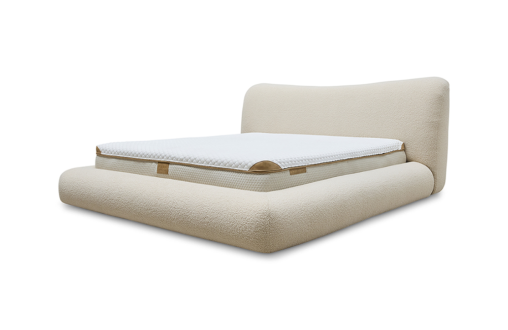 Curved bouclé bed frame in beige with a retro rounded bedhead, shown with a white mattress.