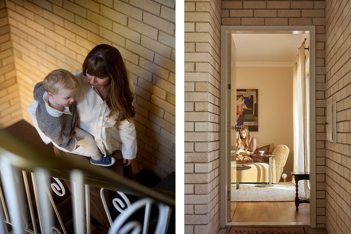 A mother and toddler on an apartment staircase, with a view through to the Sydney living room.