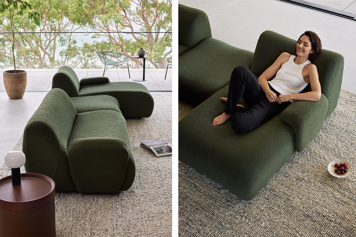 Modular, gently curved green sofa in a minimalistic living room.