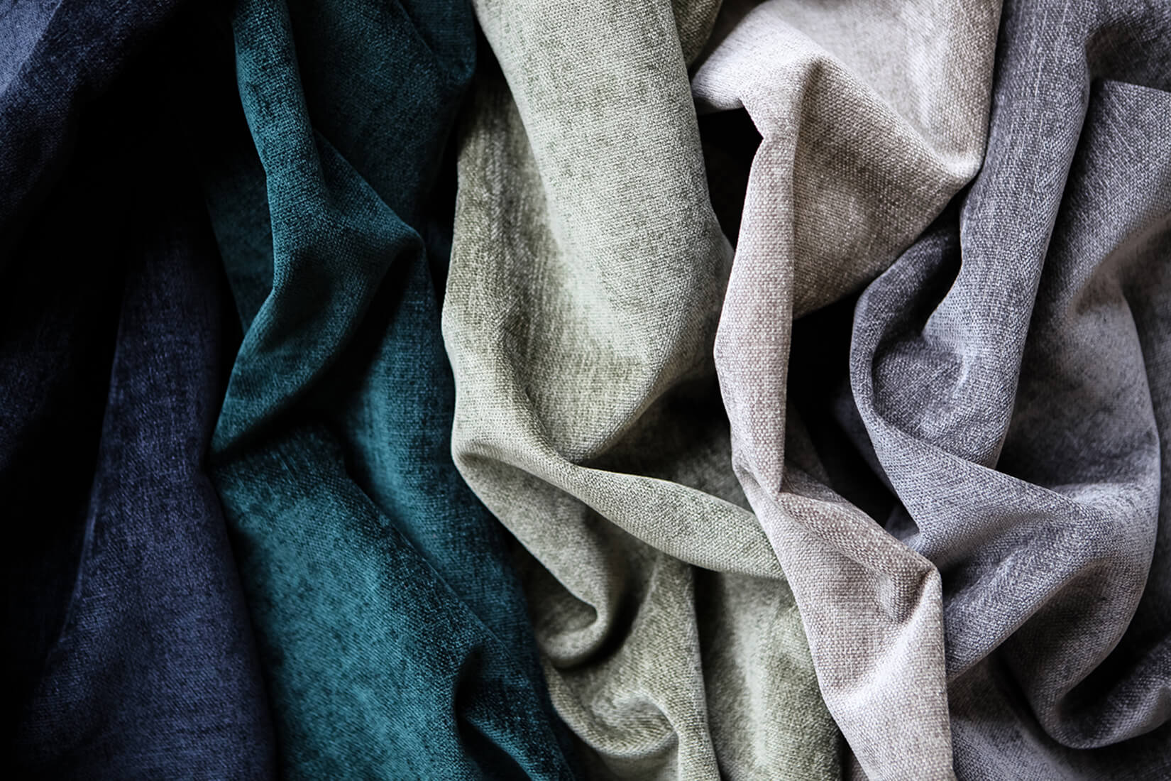 Five textural fabrics arranged side by side