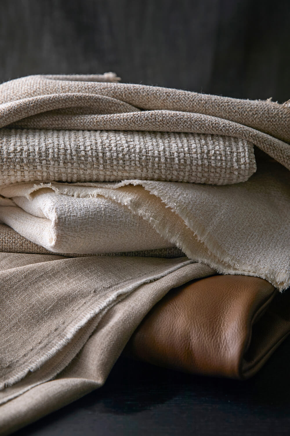 Fabrics stacked neatly in a pile