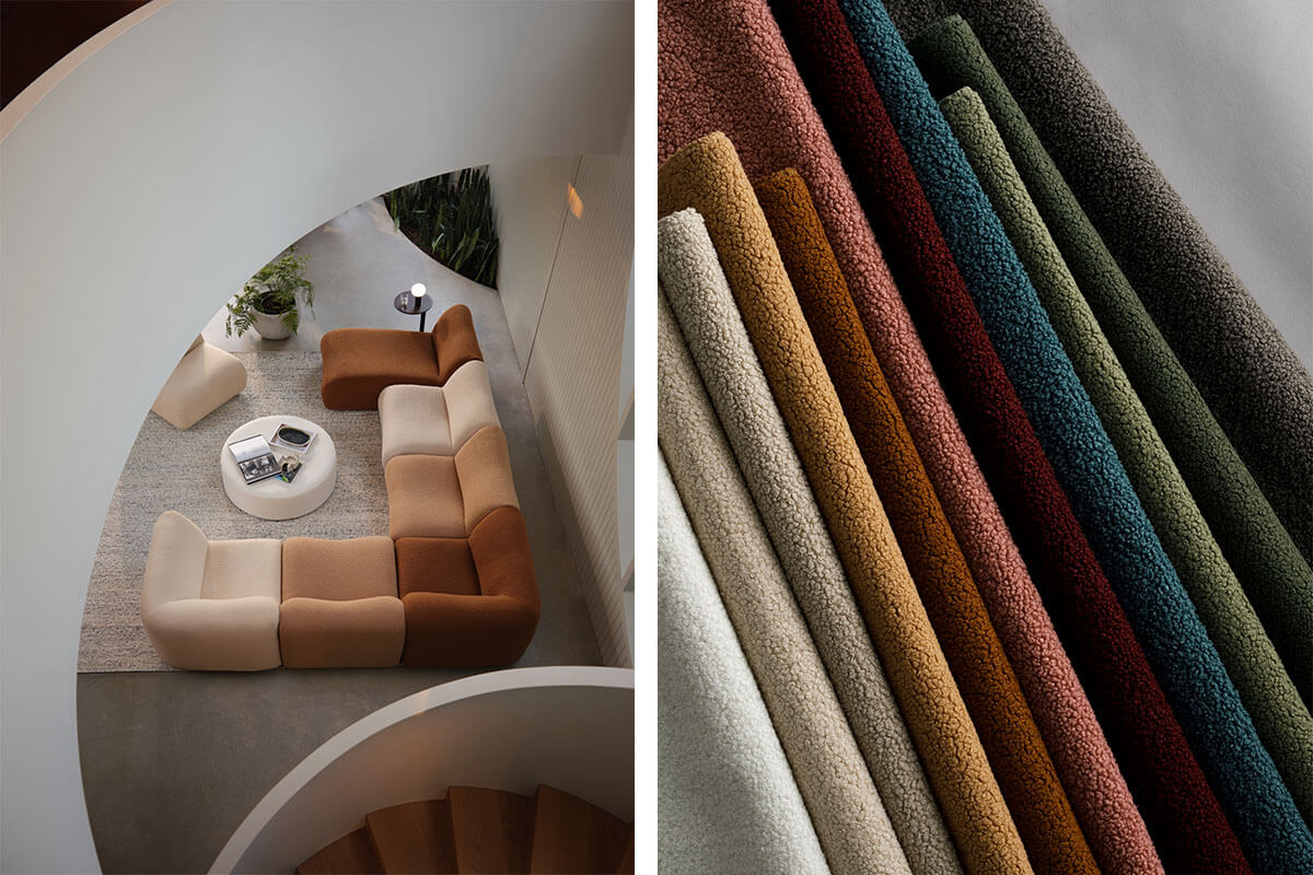 A corner sofa with each module in a different fabric, ranging from warm neutrals to chocolate tones, set beneath a bold white spiral staircase.