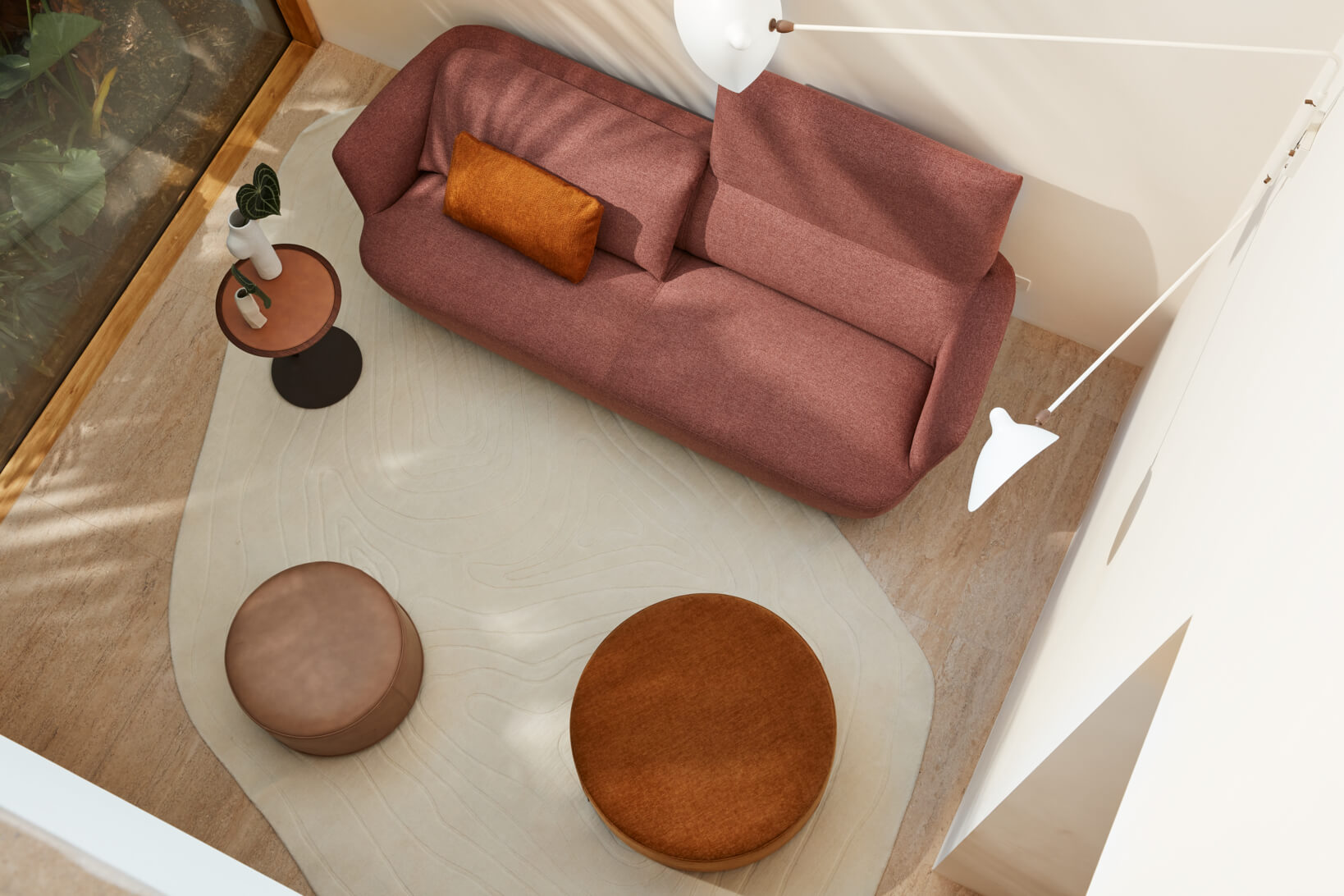 A deep blush-toned two-seater sofa styled in a contemporary, compact space. The sofa has unfolding backrests for full body support.