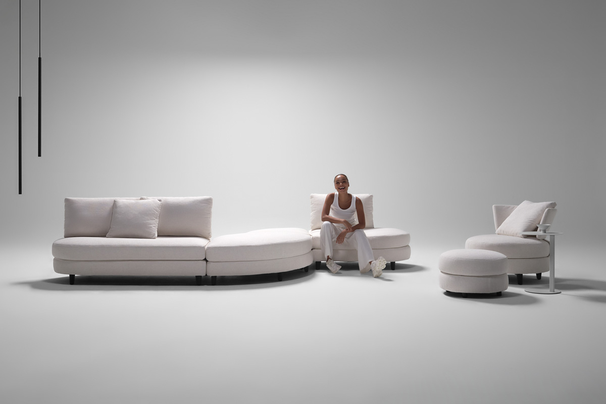 Sectional sofa shown with its removable covers in customisable finishes, featured in white fabric in S-shape configuration.