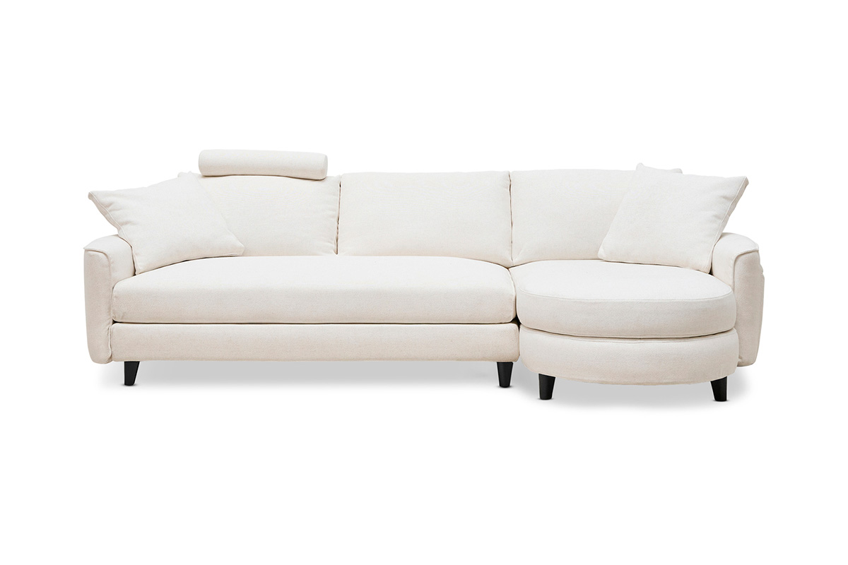 L-shaped Delta 5 in a corner configuration with a curved chaise, seating three. Styled with the bolster headrest and cushions.