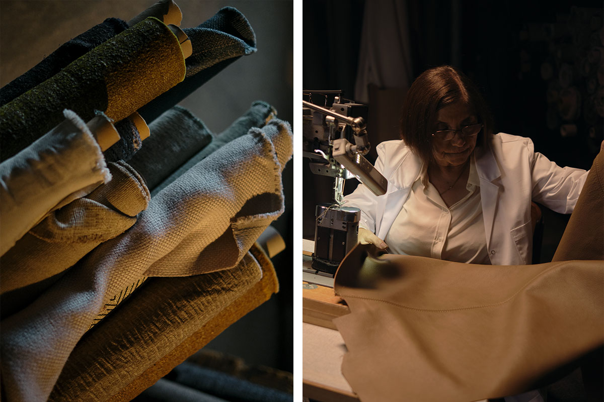 A King Living maker guides a tailored sofa cover through a sewing machine in a warmly lit workshop.