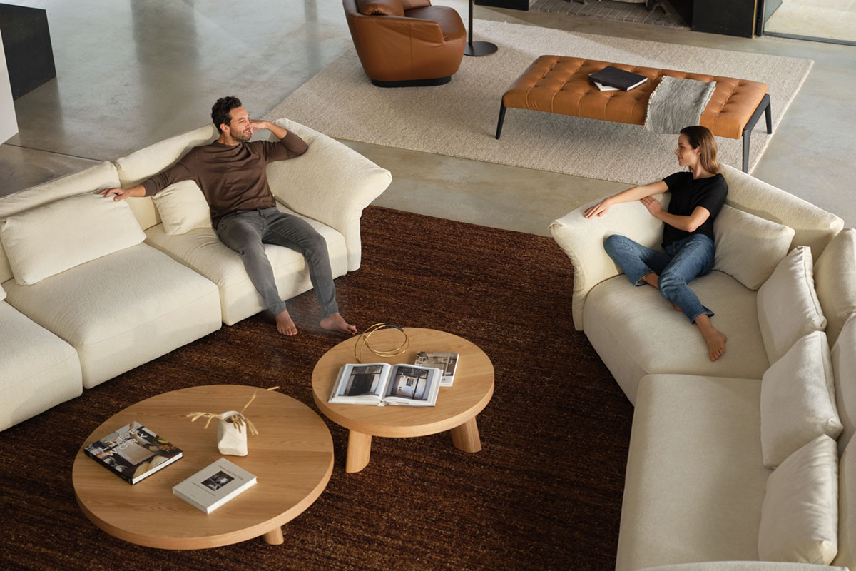 Modular sofa with a keystone chaise in modern farmhouse style living space, styled with rustic leather and timber furniture.