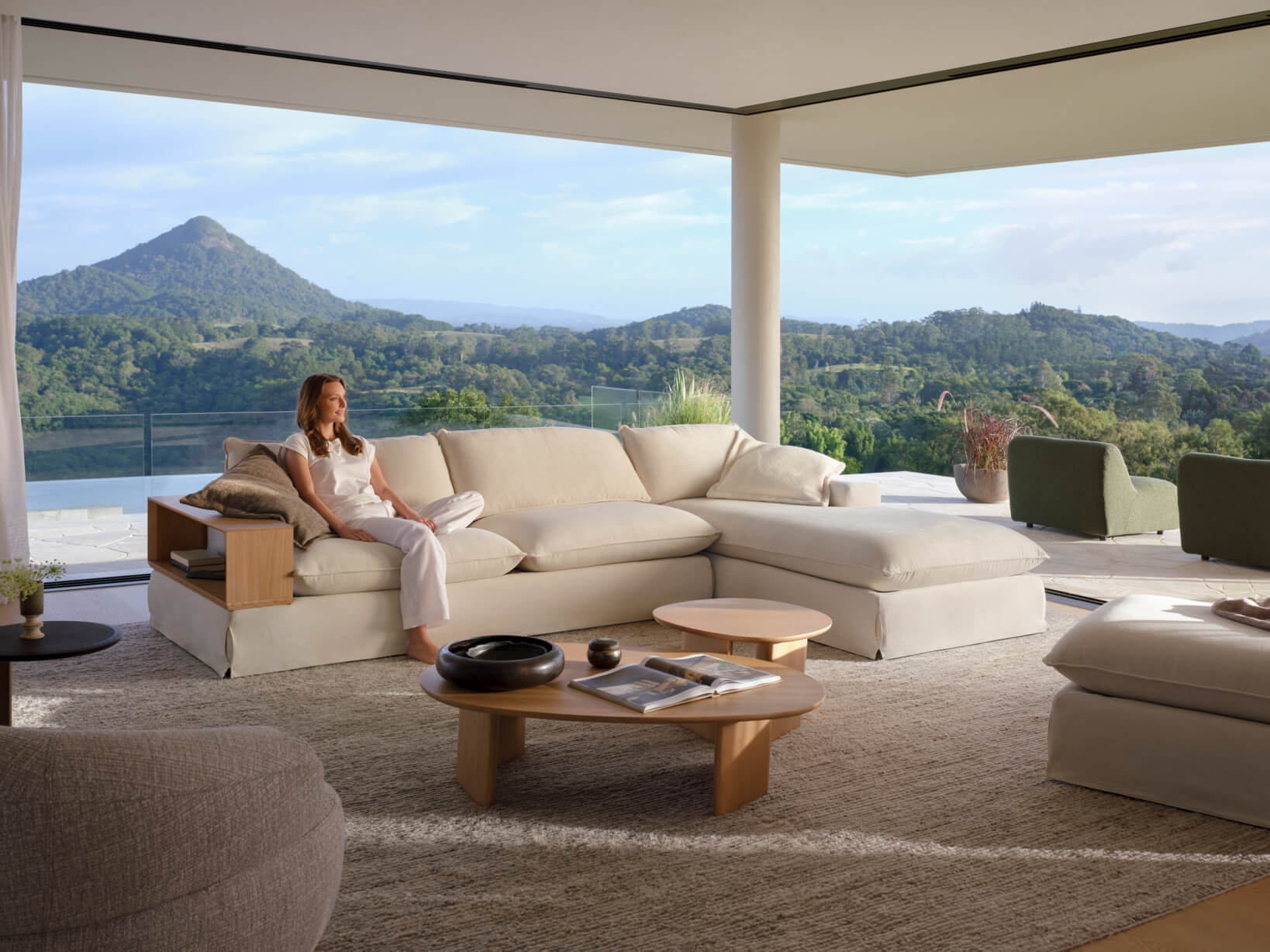 Neutral modular sofa with expansive deep seating in a contemporary open plan living space.