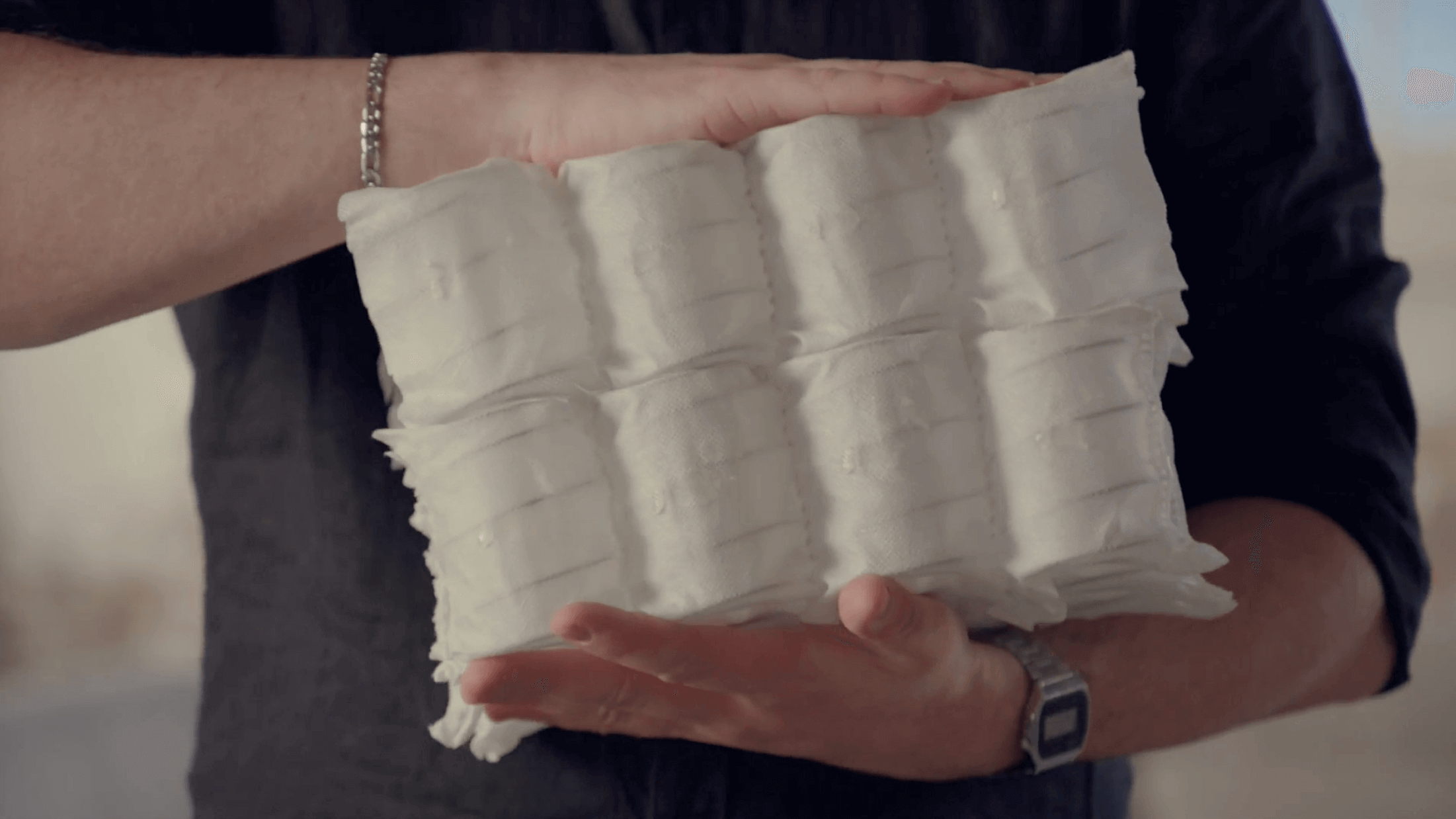 Two images of high-rebound foam being compressed and recovering to its original form.