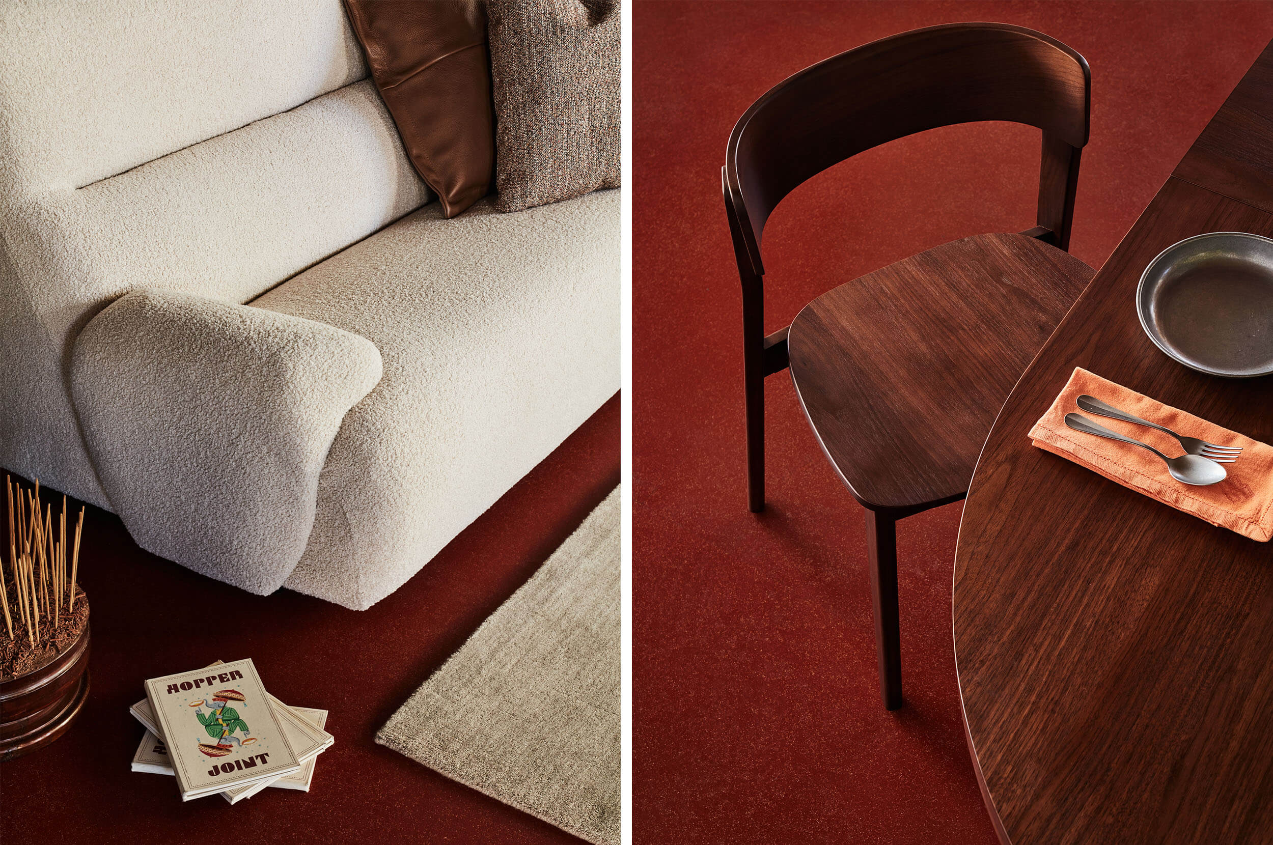 A long-shot image of a beige bouclé sofa styled with layered cushions and books (left). A timber dining table and chair, grounded by deep red flooring (right).