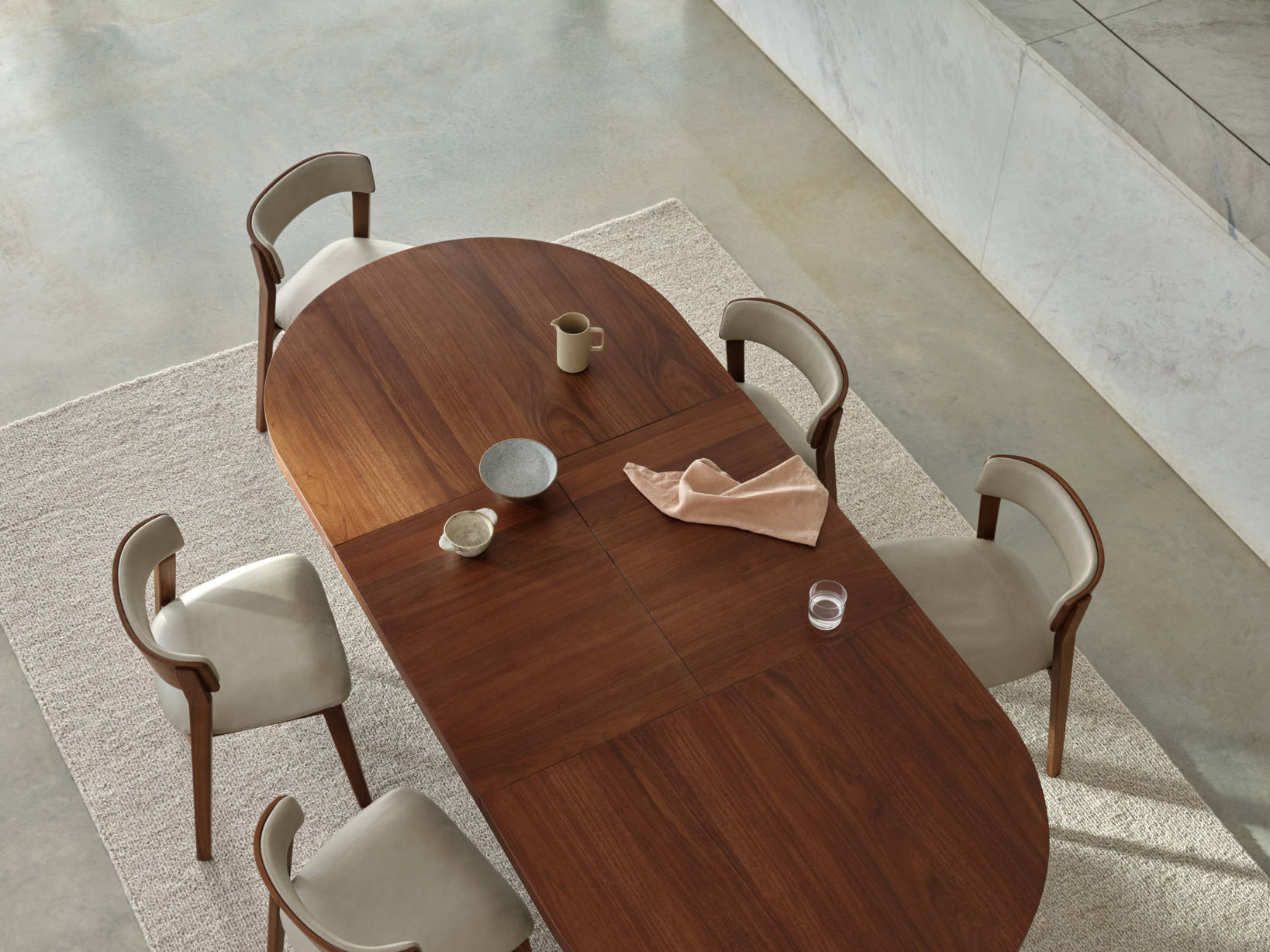 An extendable four seater dining table finished in a light contemporary timber, extending seamlessly up to six.