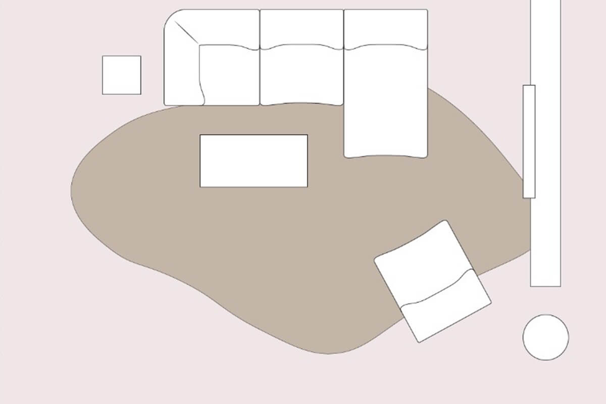 A living room layout line drawing with an L-shaped sofa positioned in the corner, against a wall, styled with an organic rug, occasional chair and coffee table.