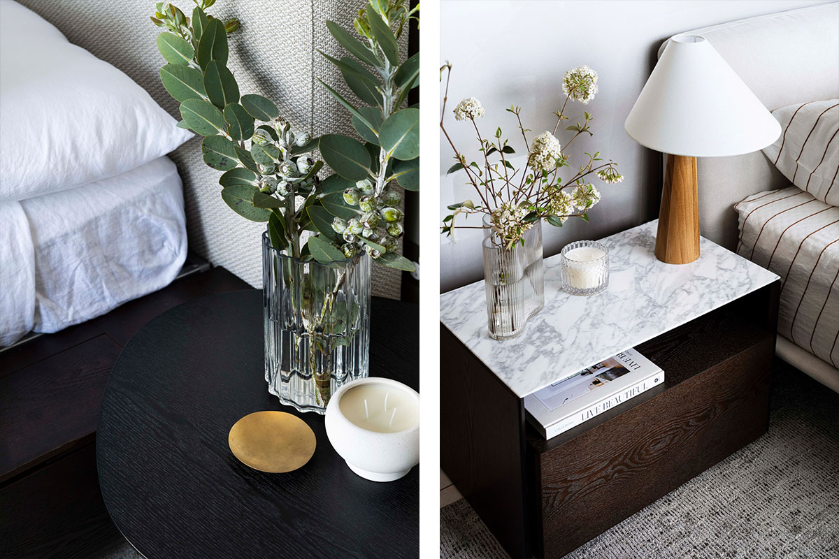 Two modern bedside table settings in a guest bedroom styled with candles, florals and gold décor.