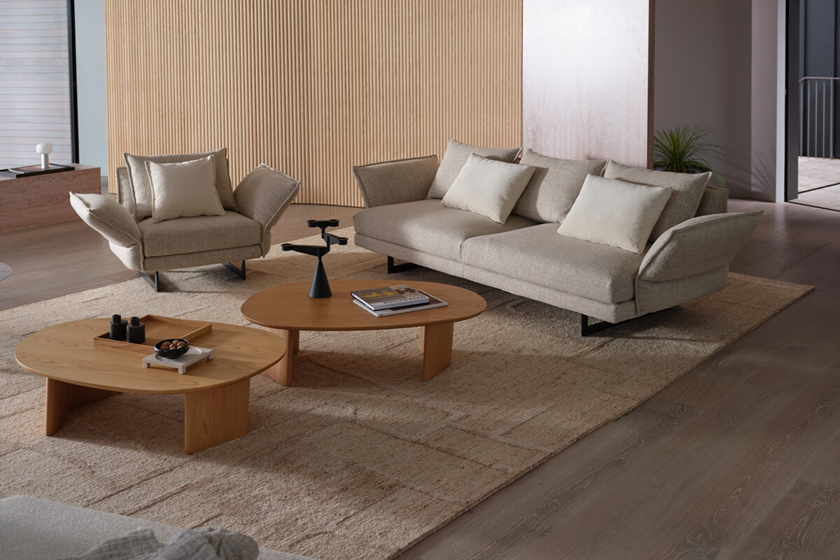 Above: neutral modular sofa with textured cushions; below: woven throws and patterned ottoman fabrics.