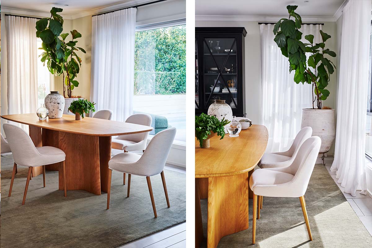 Light-filled contemporary living space with a natural oak oval dining table, sage green rug and indoor plants.