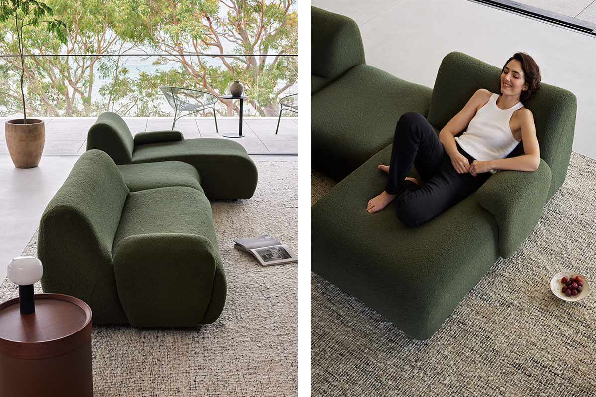 Modular, gently curved green sofa in a minimalistic living room.