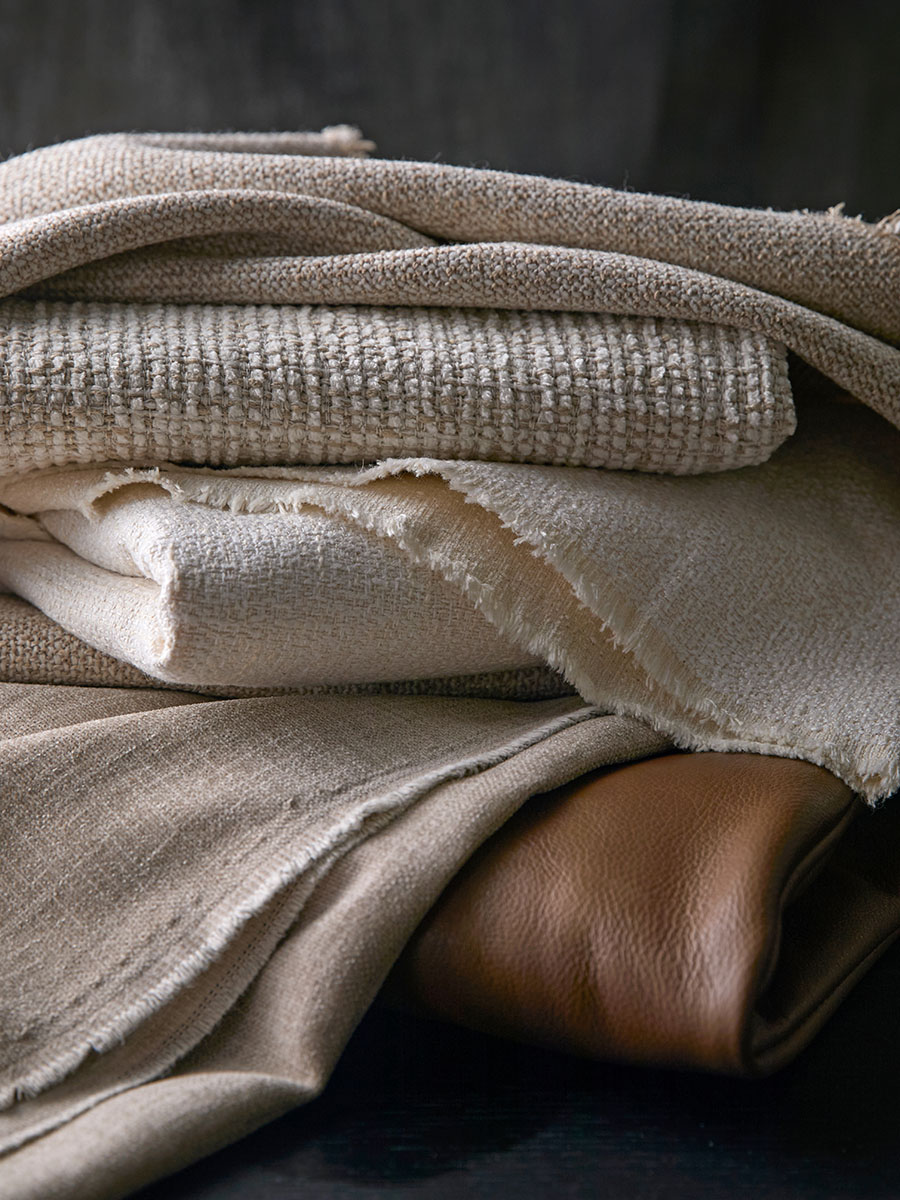 Fabrics stacked neatly in a pile