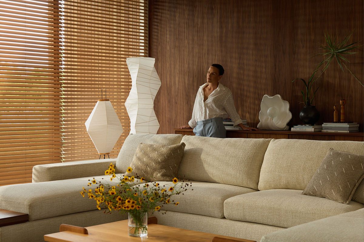 Creative director, designer and mum Olive Cooke in her earthy modern Byron Bay home with the King Living Jasper Sofa.