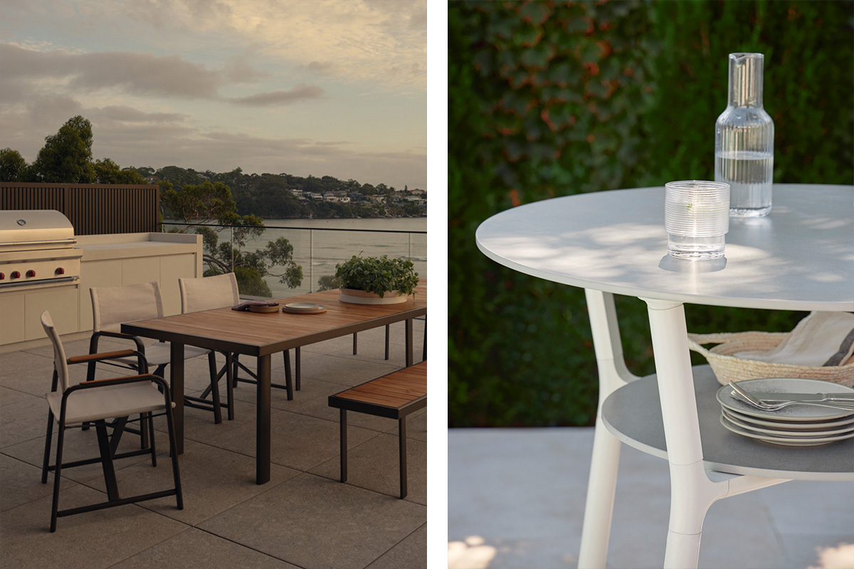 An outdoor kitchen setting with a barbeque, dining table and chairs, and an outdoor bar setup with tableware.