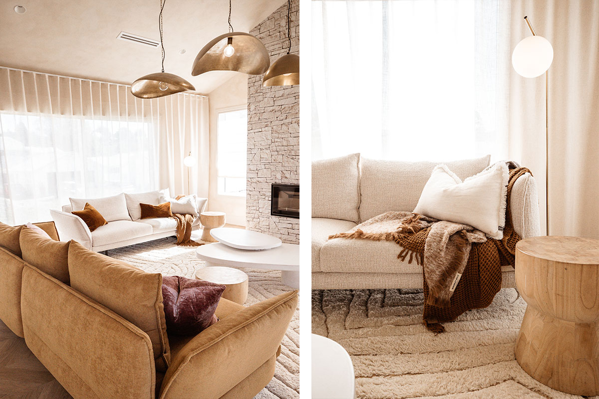 Two sofas in neutral and tobacco-toned fabric styled with layered throws, cushions and soft window drapery in a sunlit living room.